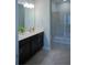 Bathroom with white vanity, neutral walls and a glass-door walk-in shower at 3023 Caneel, Winter Haven, FL 33884