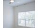 Bright bedroom with neutral walls, a ceiling fan, and a large window with blinds at 3023 Caneel, Winter Haven, FL 33884