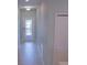 Bright hallway with tile flooring and a decorative glass front door at 3023 Caneel, Winter Haven, FL 33884