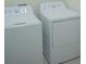 White washer and dryer appliances in a laundry area at 3023 Caneel, Winter Haven, FL 33884