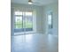 Bright living room with tile floors and sliding glass doors that open to a patio at 3023 Caneel, Winter Haven, FL 33884
