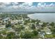 An elevated view shows a home in a leafy community near the lake at 304 W Lake Ave, Auburndale, FL 33823