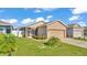 Charming single-Gathering home featuring a well-manicured lawn and an attached two-car garage at 3173 Whispering Trails Ave, Winter Haven, FL 33884