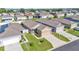 Aerial view of a charming home with well-maintained landscaping and a driveway at 3173 Whispering Trails Ave, Winter Haven, FL 33884