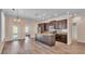 Open-concept kitchen featuring stainless steel appliances, a large island, and dark wood cabinets at 3173 Whispering Trails Ave, Winter Haven, FL 33884