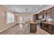 The kitchen features granite counters, stainless appliances, and a functional center island at 3173 Whispering Trails Ave, Winter Haven, FL 33884