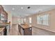 Open kitchen boasts granite counters, wood cabinets and modern stainless steel appliances at 3173 Whispering Trails Ave, Winter Haven, FL 33884