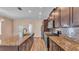 Beautiful kitchen featuring an island with granite countertops and stainless steel appliances at 3173 Whispering Trails Ave, Winter Haven, FL 33884