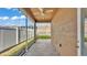 A covered patio with stone flooring, and a screened enclosure at 3173 Whispering Trails Ave, Winter Haven, FL 33884