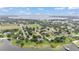 This aerial view showcases the town's close proximity to a lake at 326 Sunset Rd, Frostproof, FL 33843