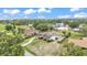 Aerial view of the property showcasing the house, pool, and surrounding greenery at 326 Sunset Rd, Frostproof, FL 33843