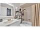 Bathroom featuring a white vanity, commode and shower/tub combination with neutral tile surround at 326 Sunset Rd, Frostproof, FL 33843