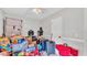View of a bedroom that is filled with toys and boxes at 326 Sunset Rd, Frostproof, FL 33843