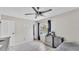 Bedroom with tile floors, neutral wall paint, ceiling fan, and window with pool view at 326 Sunset Rd, Frostproof, FL 33843