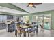 Eat-in kitchen features dark cabinets, modern appliances, tile flooring and a view to the backyard pool at 326 Sunset Rd, Frostproof, FL 33843
