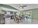 Eat-in kitchen with sleek cabinets, modern appliances and a view to the pool at 326 Sunset Rd, Frostproof, FL 33843