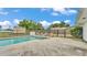 Backyard pool features a secure fence and lounge chairs at 326 Sunset Rd, Frostproof, FL 33843