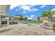Backyard pool with a screened-in lanai, and lounge chairs at 326 Sunset Rd, Frostproof, FL 33843