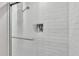 Close up of updated shower with white subway tile and niche detail at 326 Sunset Rd, Frostproof, FL 33843