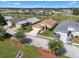 Beautifully landscaped home with manicured lawn, paver driveway, and charming curb appeal at 348 Lake Suzanne Dr, Lake Wales, FL 33859