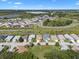 Aerial view highlights the home's location within a community, showcasing nearby amenities and green spaces at 348 Lake Suzanne Dr, Lake Wales, FL 33859