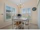 Charming breakfast nook with bright windows and a white table and chairs at 348 Lake Suzanne Dr, Lake Wales, FL 33859