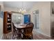 Dining room features wood floors, a blue cabinet, and view to the kitchen at 348 Lake Suzanne Dr, Lake Wales, FL 33859
