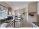Bright kitchen with stone countertops and an adjacent dining area with natural light at 348 Lake Suzanne Dr, Lake Wales, FL 33859