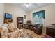 Cozy living room with comfortable seating and wood floors at 348 Lake Suzanne Dr, Lake Wales, FL 33859