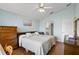 Spacious main bedroom with wood floors, a ceiling fan, and ample natural light at 348 Lake Suzanne Dr, Lake Wales, FL 33859