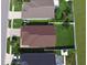 Shows the layout of neighboring homes, showcasing well-maintained green lawns and symmetrical landscaping at 373 St Georges Cir, Eagle Lake, FL 33839