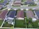 Neighborhood view showing backyard sizes, home styles, street layout, and proximity to other homes at 373 St Georges Cir, Eagle Lake, FL 33839