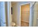 View into a bathroom with a toilet and walk-in closet at 373 St Georges Cir, Eagle Lake, FL 33839