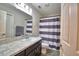 Bathroom featuring a single sink and a shower with a striped curtain at 373 St Georges Cir, Eagle Lake, FL 33839