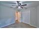 Bedroom featuring carpet, a ceiling fan, and a closet at 373 St Georges Cir, Eagle Lake, FL 33839