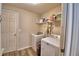 Laundry room featuring wood style floors, shelving, and newer washer and dryer at 373 St Georges Cir, Eagle Lake, FL 33839