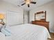 Bright bedroom featuring a comfortable bed, dresser, and ample closet space at 3802 Litchfield Loop, Lake Wales, FL 33859