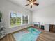 Bright bedroom with hardwood floors, shuttered windows, and a tranquil atmosphere at 3802 Litchfield Loop, Lake Wales, FL 33859