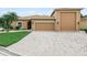 Well-maintained home with a two-car garage, mature landscaping, and a welcoming entryway offers great curb appeal at 3802 Litchfield Loop, Lake Wales, FL 33859