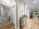 Hallway showcasing access to a bathroom and with decorative furniture enhancing its architectural arches at 3802 Litchfield Loop, Lake Wales, FL 33859