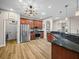 Modern kitchen with stainless steel appliances, granite countertops, and ample cabinetry provides a sleek, functional design at 3802 Litchfield Loop, Lake Wales, FL 33859