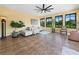 Spacious living area with tile floors, comfortable seating, and natural light from large windows at 3802 Litchfield Loop, Lake Wales, FL 33859