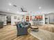 Comfortable living space open to kitchen and dining areas, featuring modern furnishings and abundant natural light at 3802 Litchfield Loop, Lake Wales, FL 33859