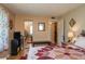 Comfortable bedroom with mirrored closet doors, accent furniture, and a view to the en suite bath at 400 El Camino Dr # 201, Winter Haven, FL 33884