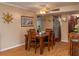 Inviting dining room with seating for four adjacent to the kitchenette at 400 El Camino Dr # 201, Winter Haven, FL 33884