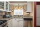 Practical kitchen with granite countertops and stainless steel appliances at 400 El Camino Dr # 201, Winter Haven, FL 33884