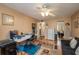Bright office space with a ceiling fan, large desk, and comfortable seating area at 400 El Camino Dr # 201, Winter Haven, FL 33884