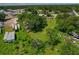 The aerial view highlights the lot's position relative to trailers, foliage, and a distant residential area at 407 Snively Ave, Winter Haven, FL 33880