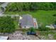 Aerial view of a single Gathering home with a large yard and mature trees at 407 Snively Ave, Winter Haven, FL 33880