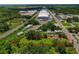 An aerial view of the property with red boundary lines showcasing the proximity to commercial areas and transport routes at 407 Snively Ave, Winter Haven, FL 33880